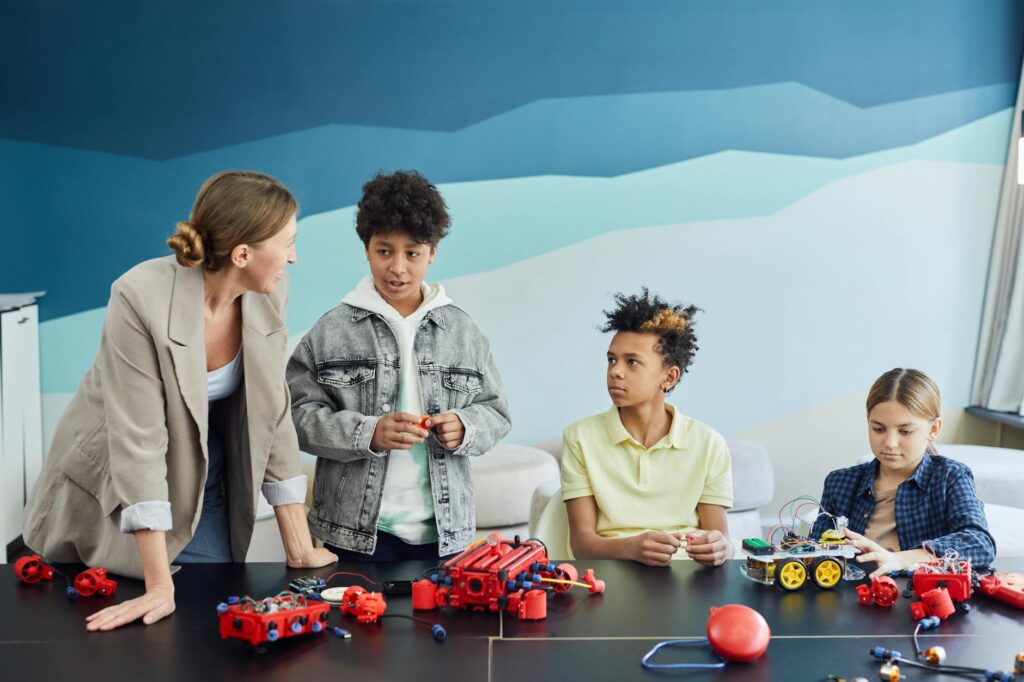 diverse group of minority STEM students collaborating on a engineering project