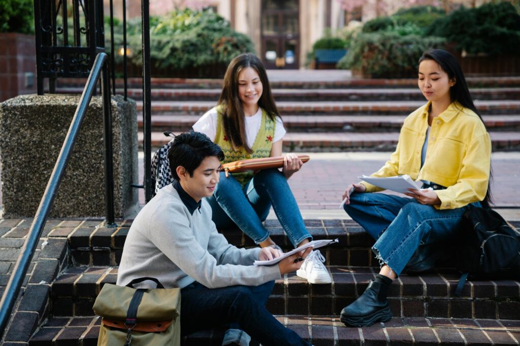 diverse minority college students studying together on campus