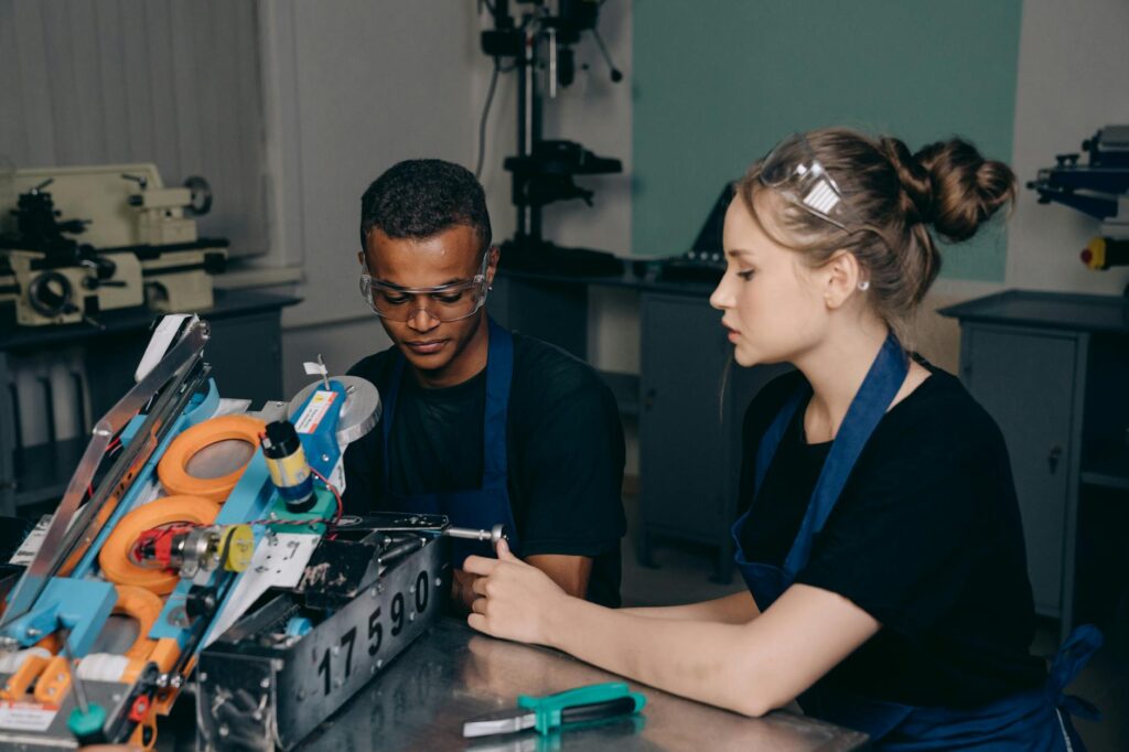 diverse STEM students collaborating on engineering project university