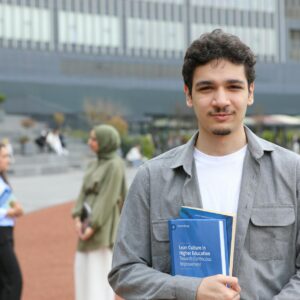 international students celebrating scholarship acceptance letters on campus