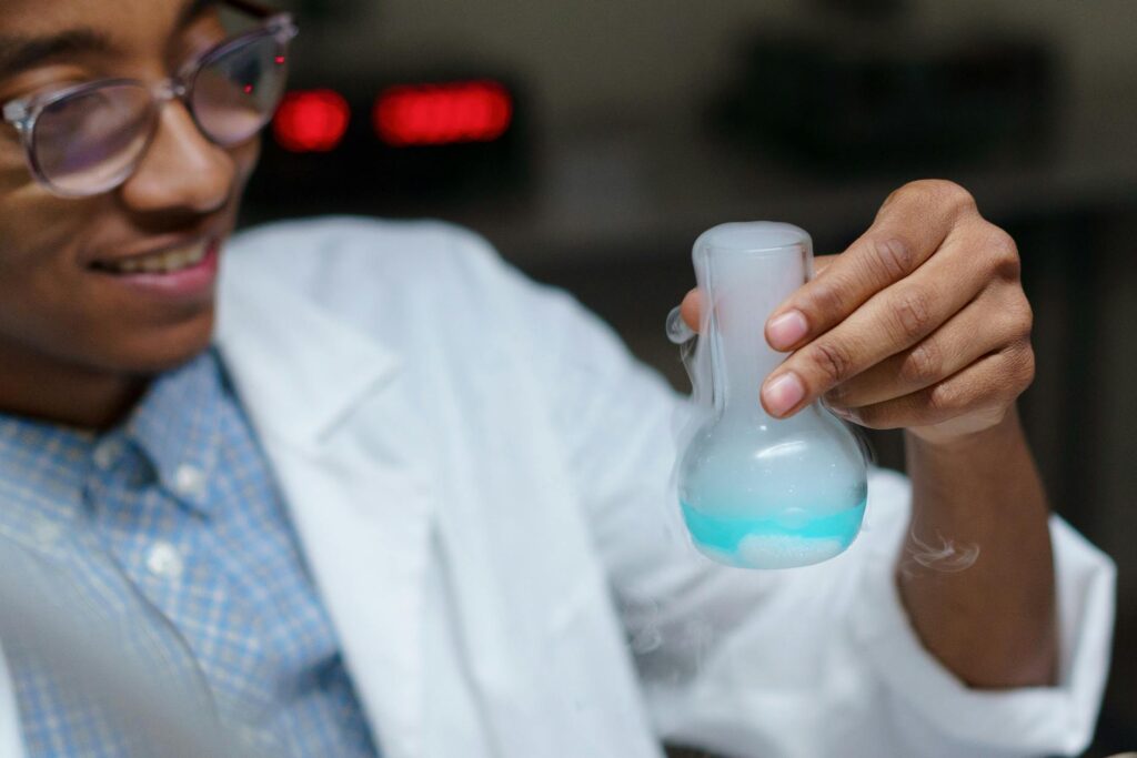 minority college student studying science in a bright university lab