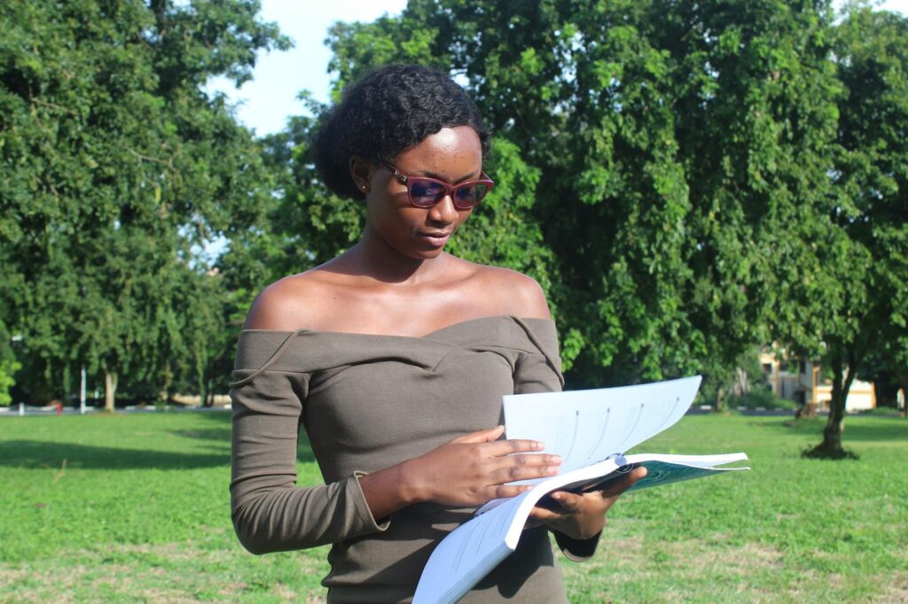 Nigerian government scholarship board office with students submitting documents