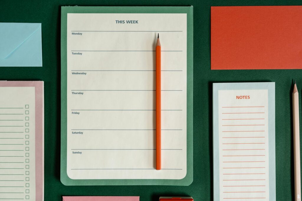 organized scholarship application checklist and calendar on a desk